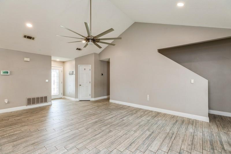 439 Northview Lane Crestview, FL 32536 - Photo 7 of 26 a view of an empty room with window and wooden floor