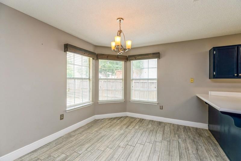 439 Northview Lane Crestview, FL 32536 - Photo 8 of 26 a view of an empty room with wooden floor and a window