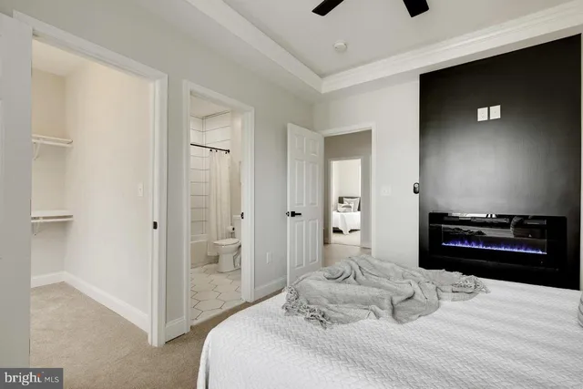 a bedroom with a bed and a television