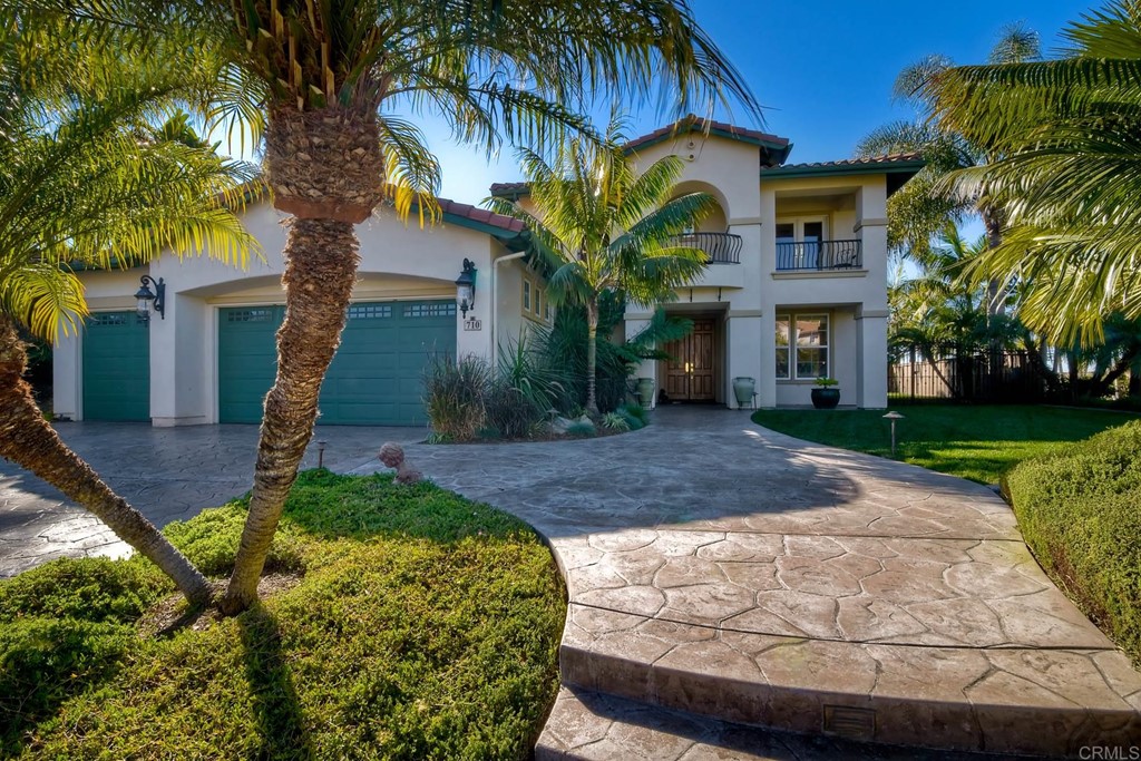 710 West Bluff Drive Encinitas, CA 92024 - Photo 1 of 12 a front view of a house with garden