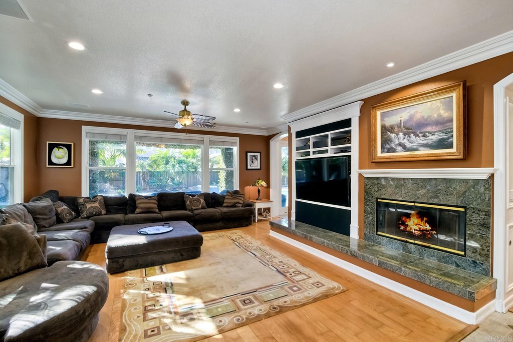 710 West Bluff Drive Encinitas, CA 92024 - Photo 6 of 12 a living room with furniture window and a fireplace