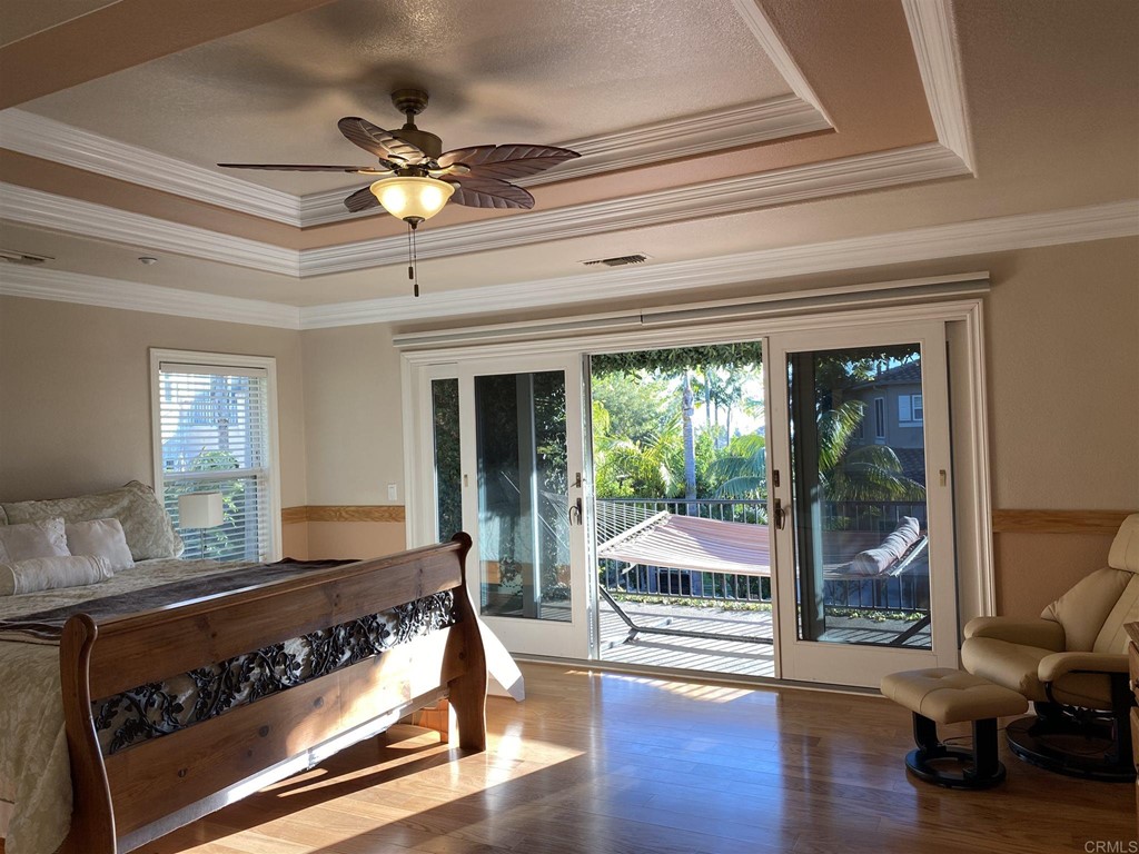 710 West Bluff Drive Encinitas, CA 92024 - Photo 8 of 12 a living room with hardwood floor and a ceiling fan