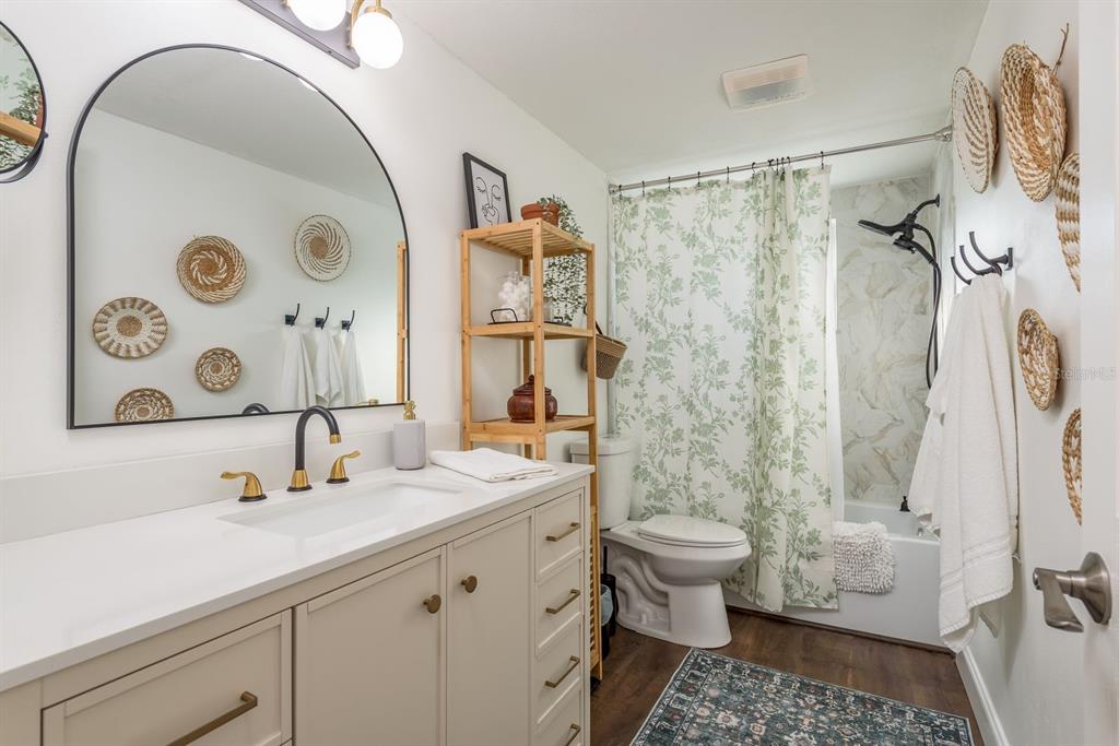 9110 Rainbow Lane Port Richey, FL 34668 - Photo 23 of 29 a bathroom with a sink and a mirror