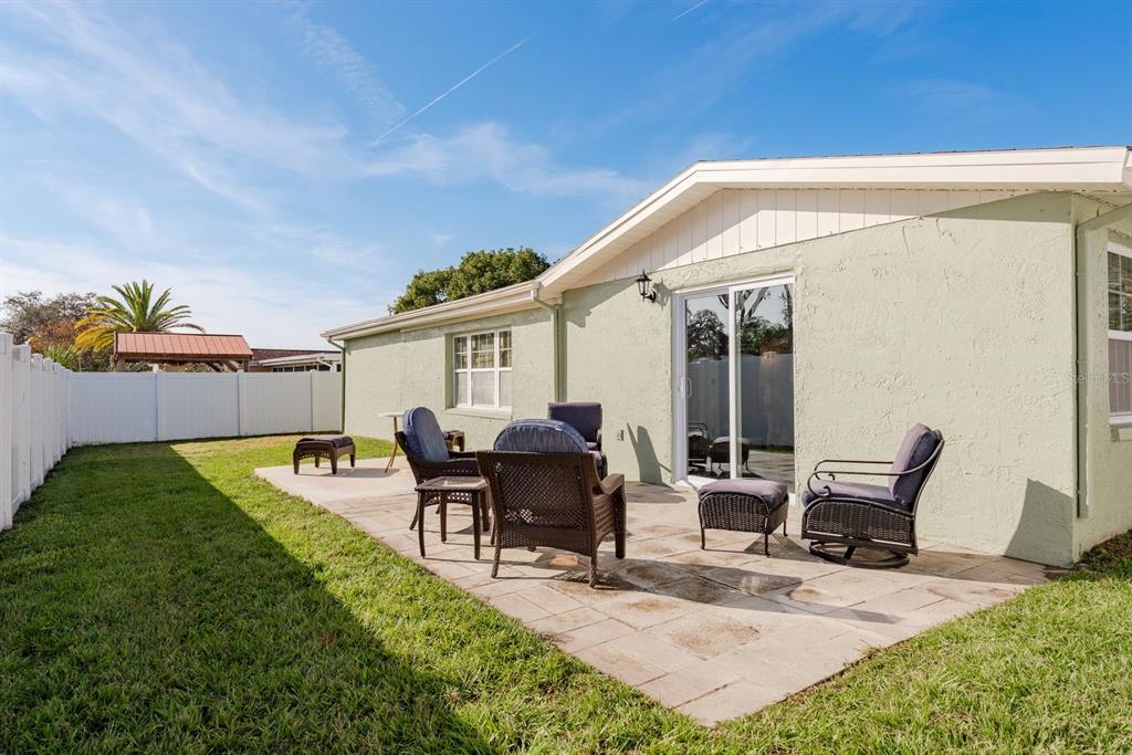 9110 Rainbow Lane Port Richey, FL 34668 - Photo 27 of 29 a view of a house with backyard and sitting area