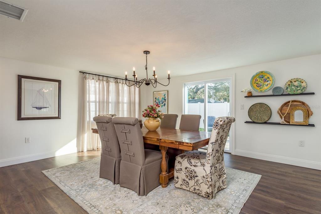 9110 Rainbow Lane Port Richey, FL 34668 - Photo 3 of 29 a view of a dining room with furniture