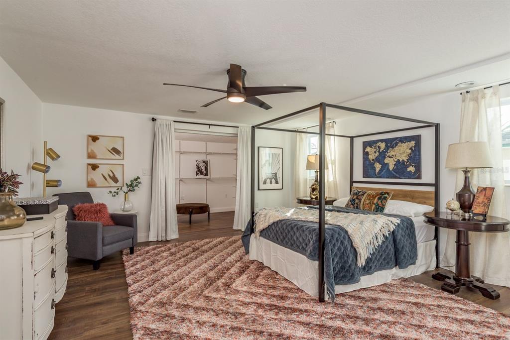 9110 Rainbow Lane Port Richey, FL 34668 - Photo 5 of 29 a bed room with a bed and dresser