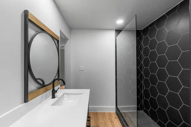 a bathroom with a sink and mirror