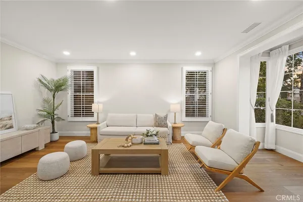 a view of a living room and wooden floor