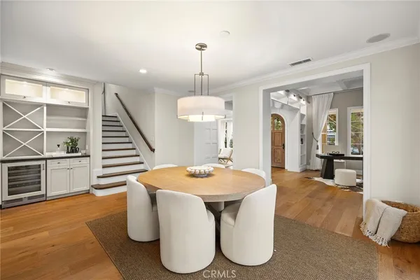 a kitchen with stainless steel appliances a stove a white cabinet and a granite counter tops