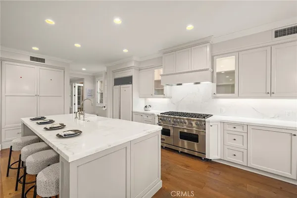 a kitchen with a dining table and chairs