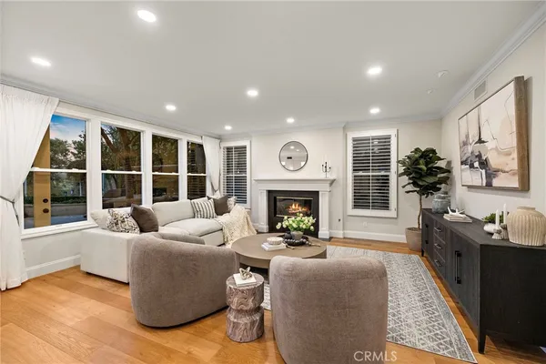 a spacious bedroom with a bed window and walk in closet
