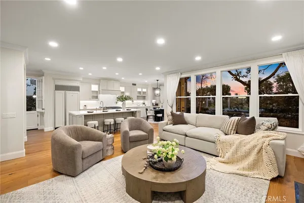 a spacious bedroom with a bed couch and a window