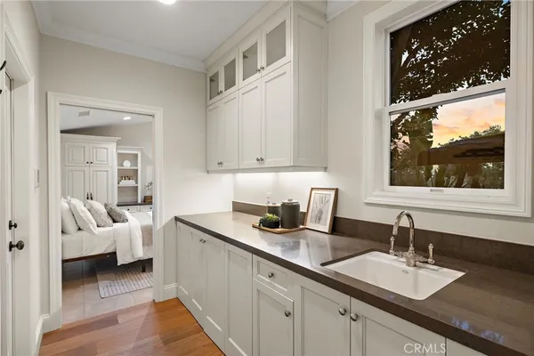 a spacious bathroom with a granite countertop sink mirror and bathtub