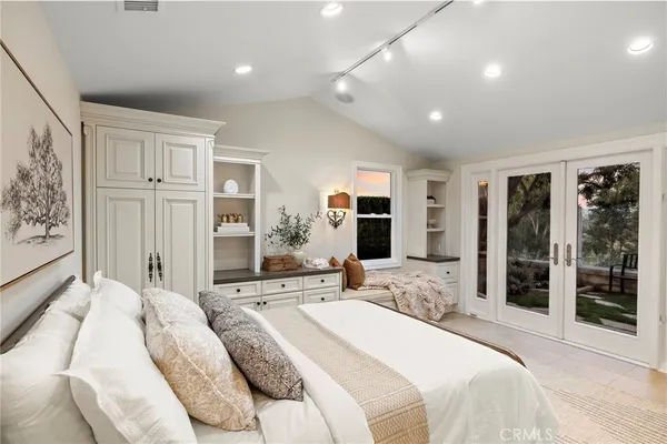 a spacious bathroom with a double vanity sink a large mirror a shower and a bathtub