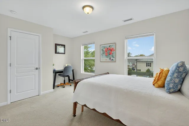 a bedroom with a bed and a table