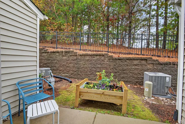 a view of a terrace with chairs and a fire pit