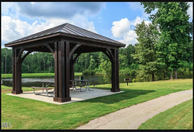 a view of a deck with a big yard