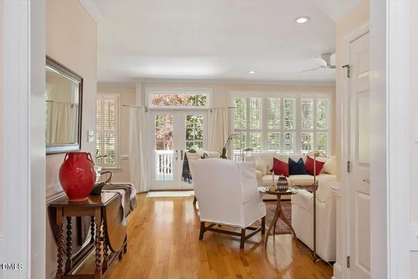 a living room with furniture fireplace and window