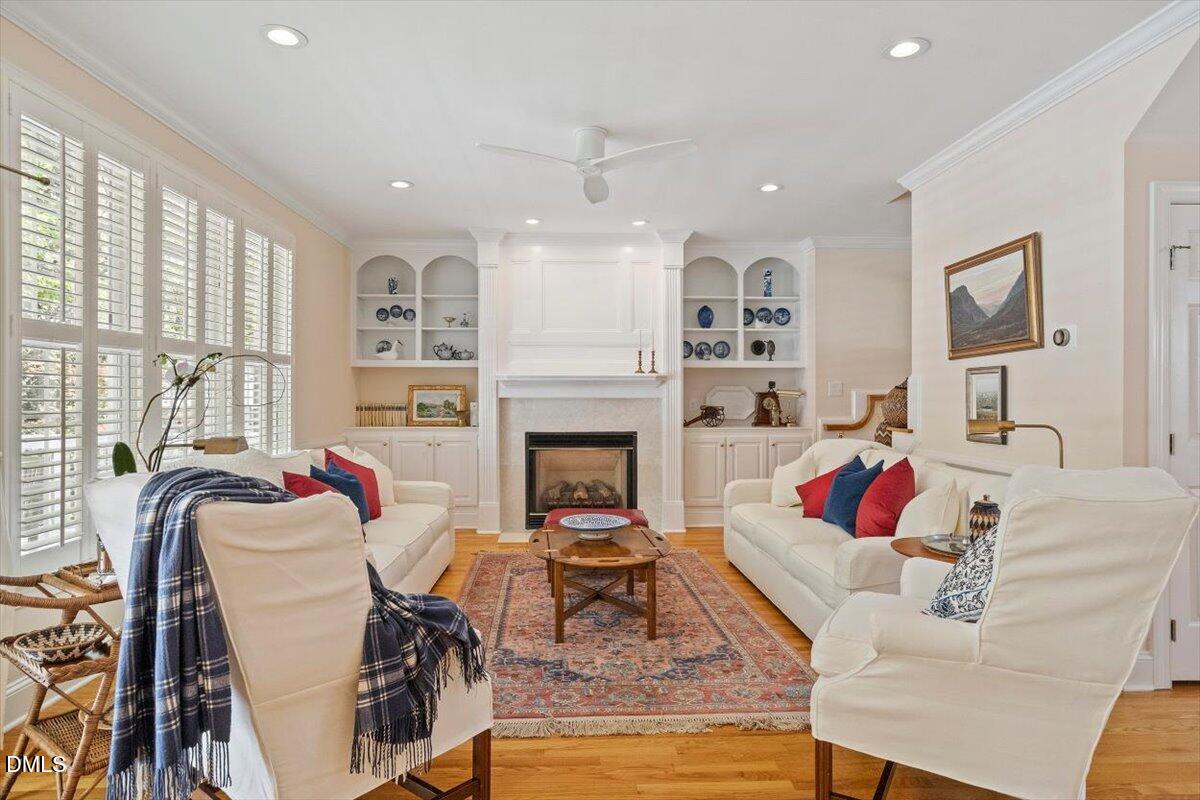 9108 Hometown Drive Raleigh, NC 27615 - Photo 20 of 41 a living room with furniture fireplace and window
