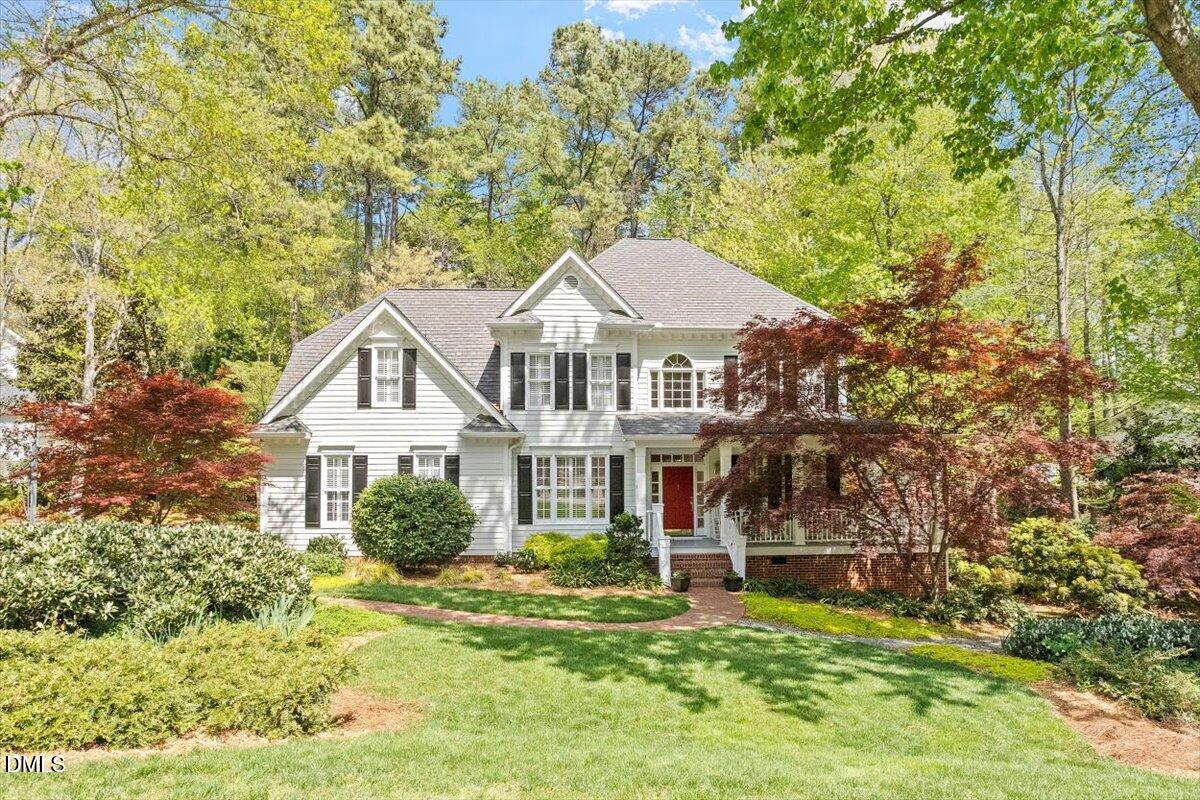 9108 Hometown Drive Raleigh, NC 27615 - Photo 2 of 41 a front view of a house with a garden