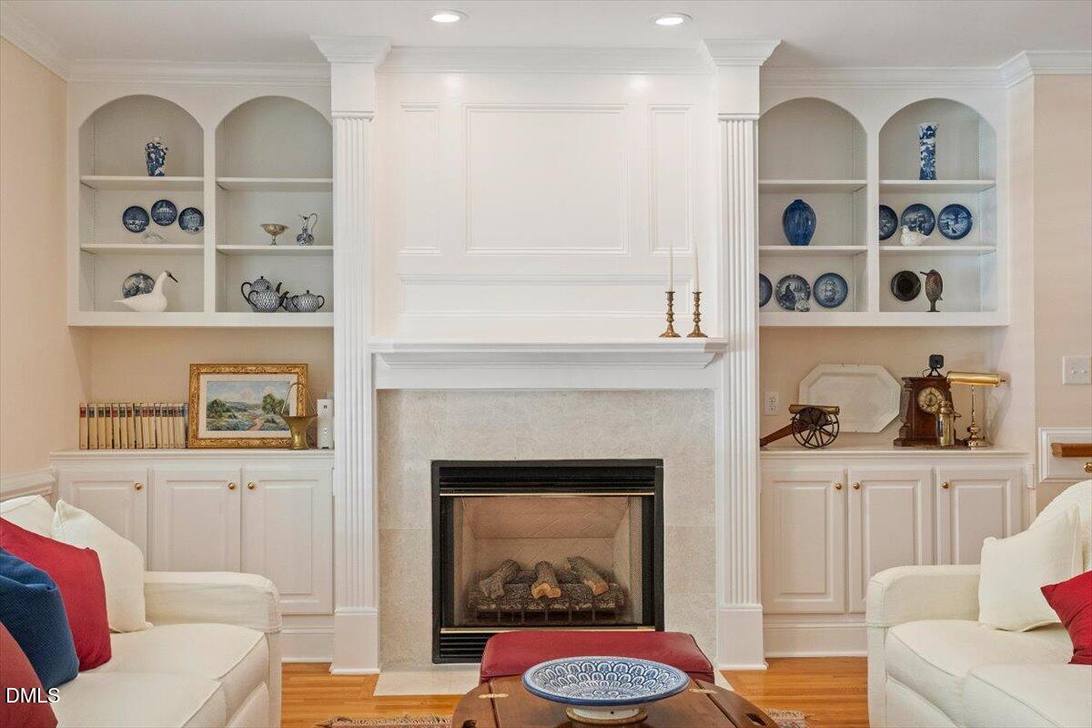 9108 Hometown Drive Raleigh, NC 27615 - Photo 21 of 41 a living room with furniture fireplace and window