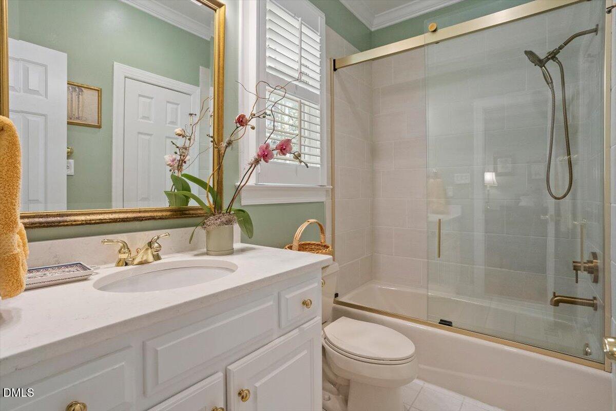 9108 Hometown Drive Raleigh, NC 27615 - Photo 28 of 41 a bathroom with a sink toilet and shower