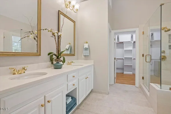 a bed room with a bed and a refrigerator