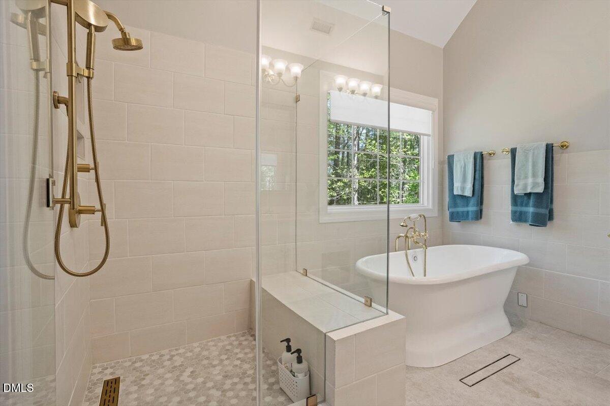 9108 Hometown Drive Raleigh, NC 27615 - Photo 36 of 41 a bathroom with a sink a toilet and shower