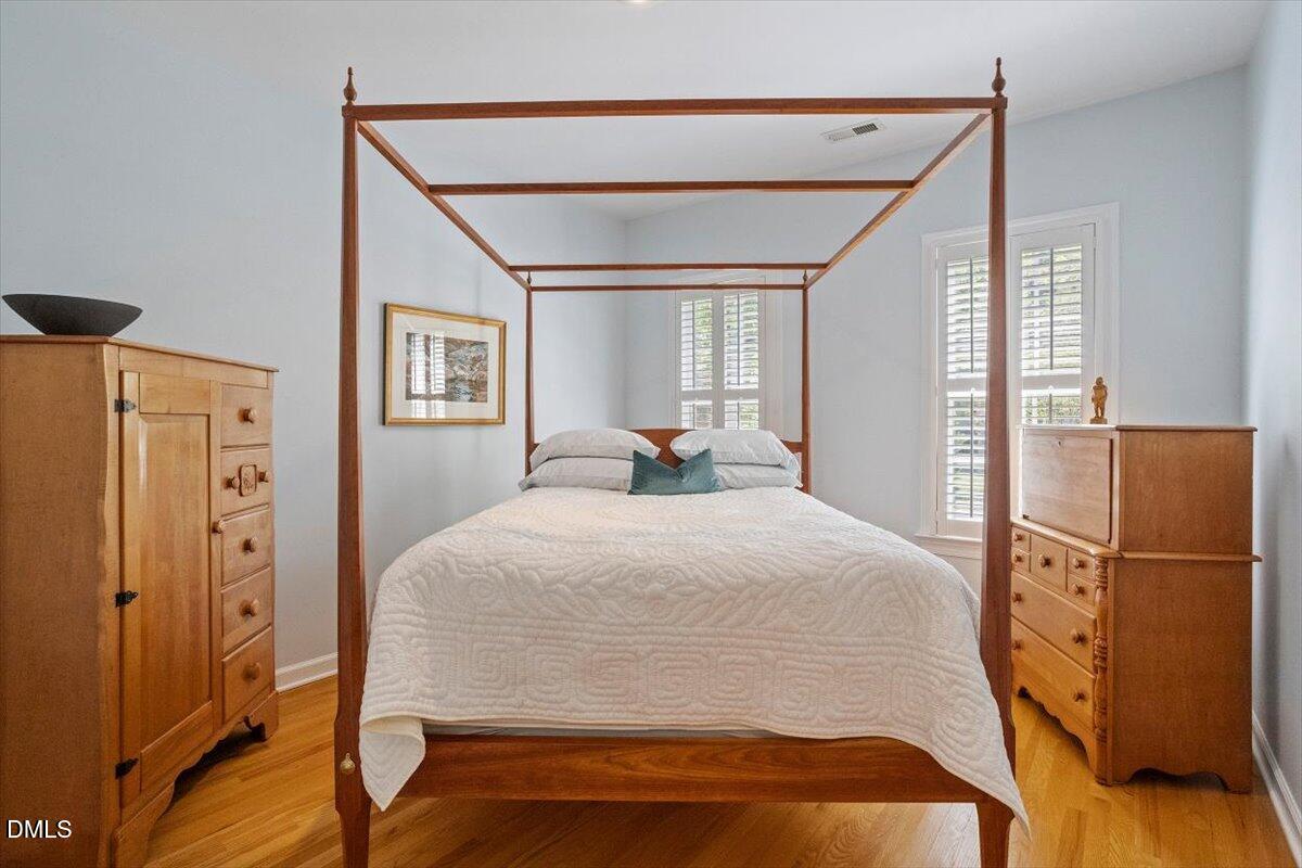 9108 Hometown Drive Raleigh, NC 27615 - Photo 37 of 41 a bed room with a bed and a refrigerator