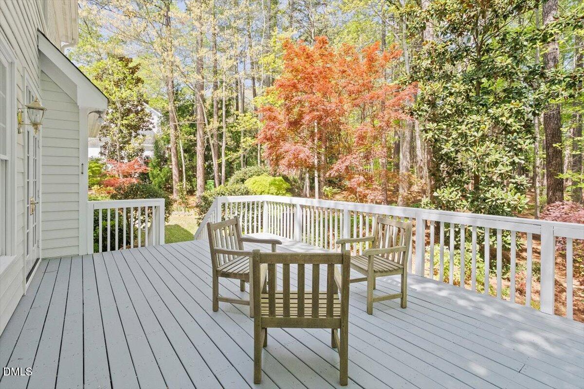 9108 Hometown Drive Raleigh, NC 27615 - Photo 10 of 41 a view of balcony with furniture and wooden floor