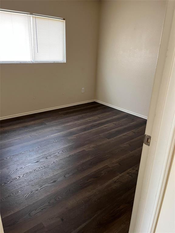 10548 Flagstaff Run Fort Worth, TX 76140 - Photo 11 of 20 a view of a small space with wooden floor and a window