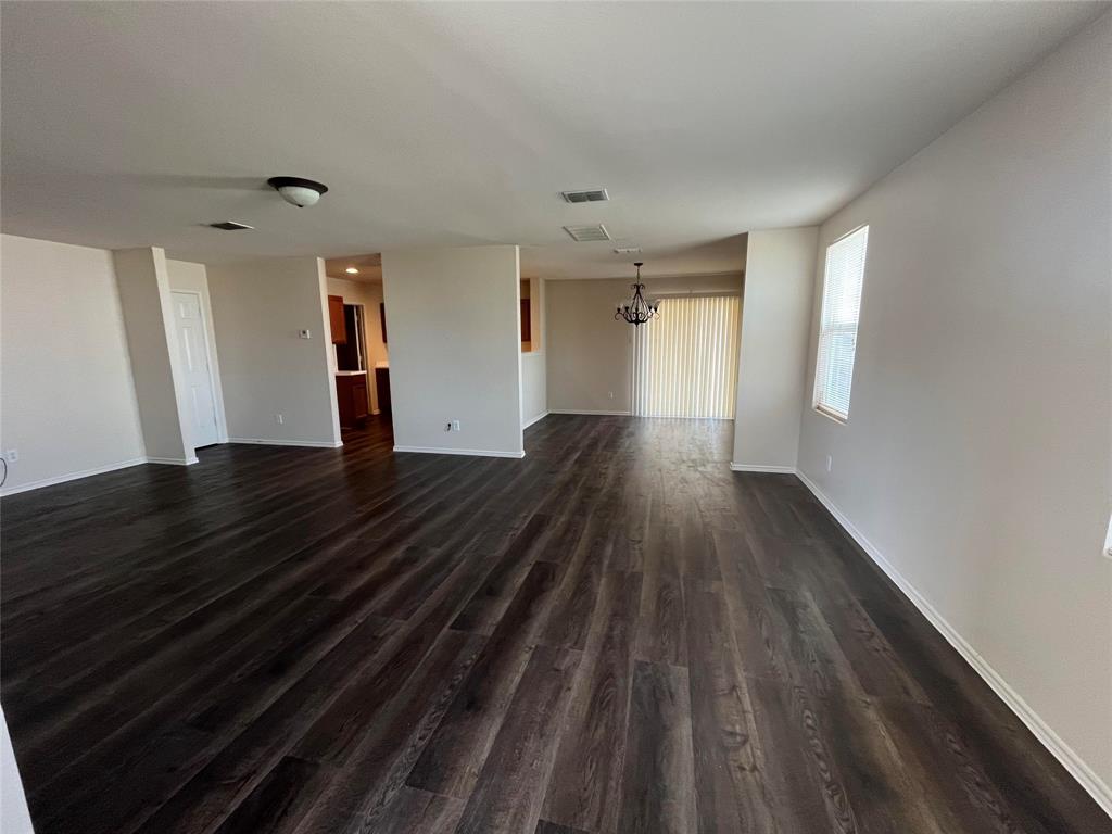 10548 Flagstaff Run Fort Worth, TX 76140 - Photo 7 of 20 a view of empty room with wooden floor