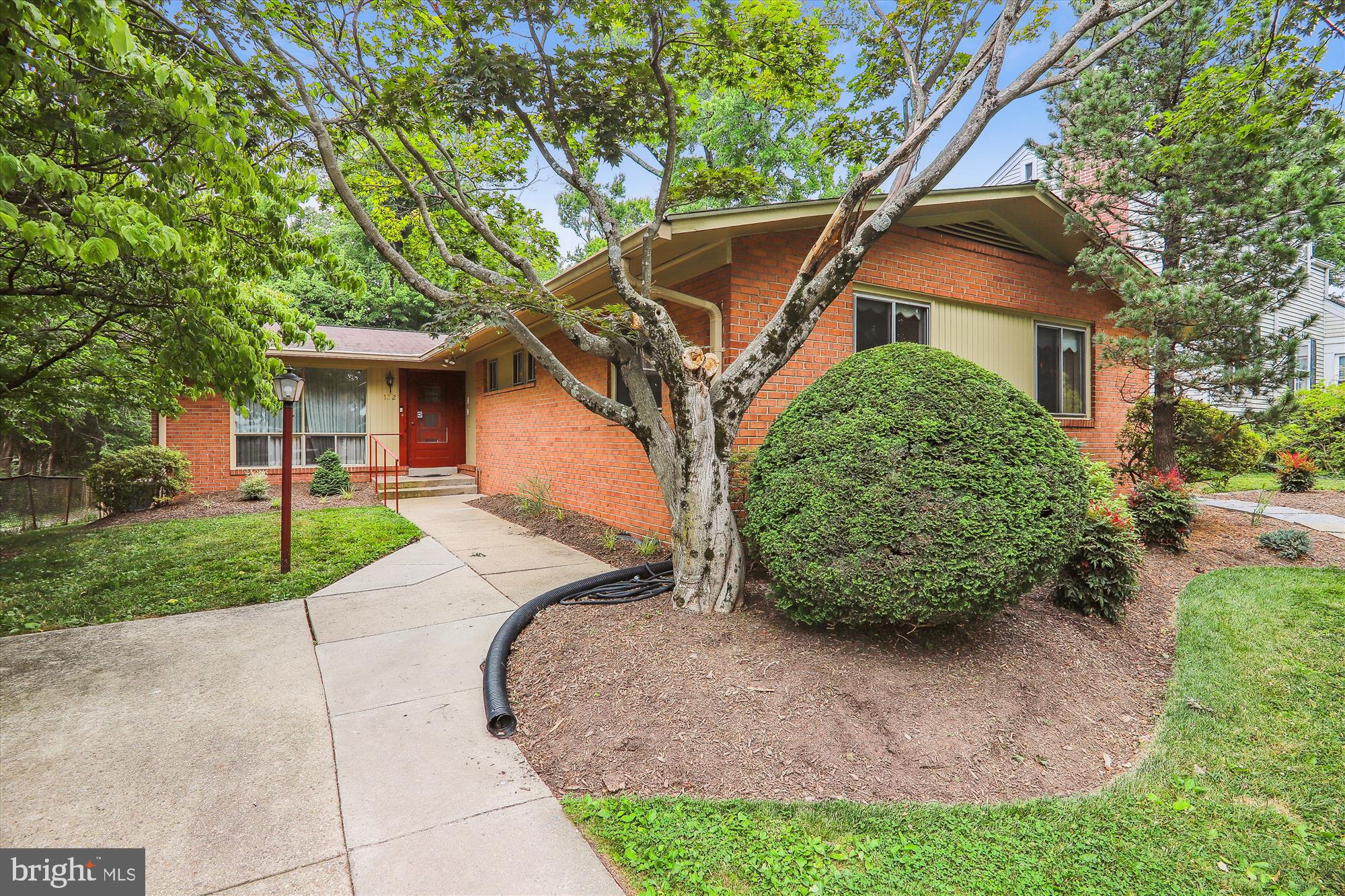 122 St Lawrence Drive Silver Spring, MD 20901 - Photo 2 of 9 a front view of a house with garden