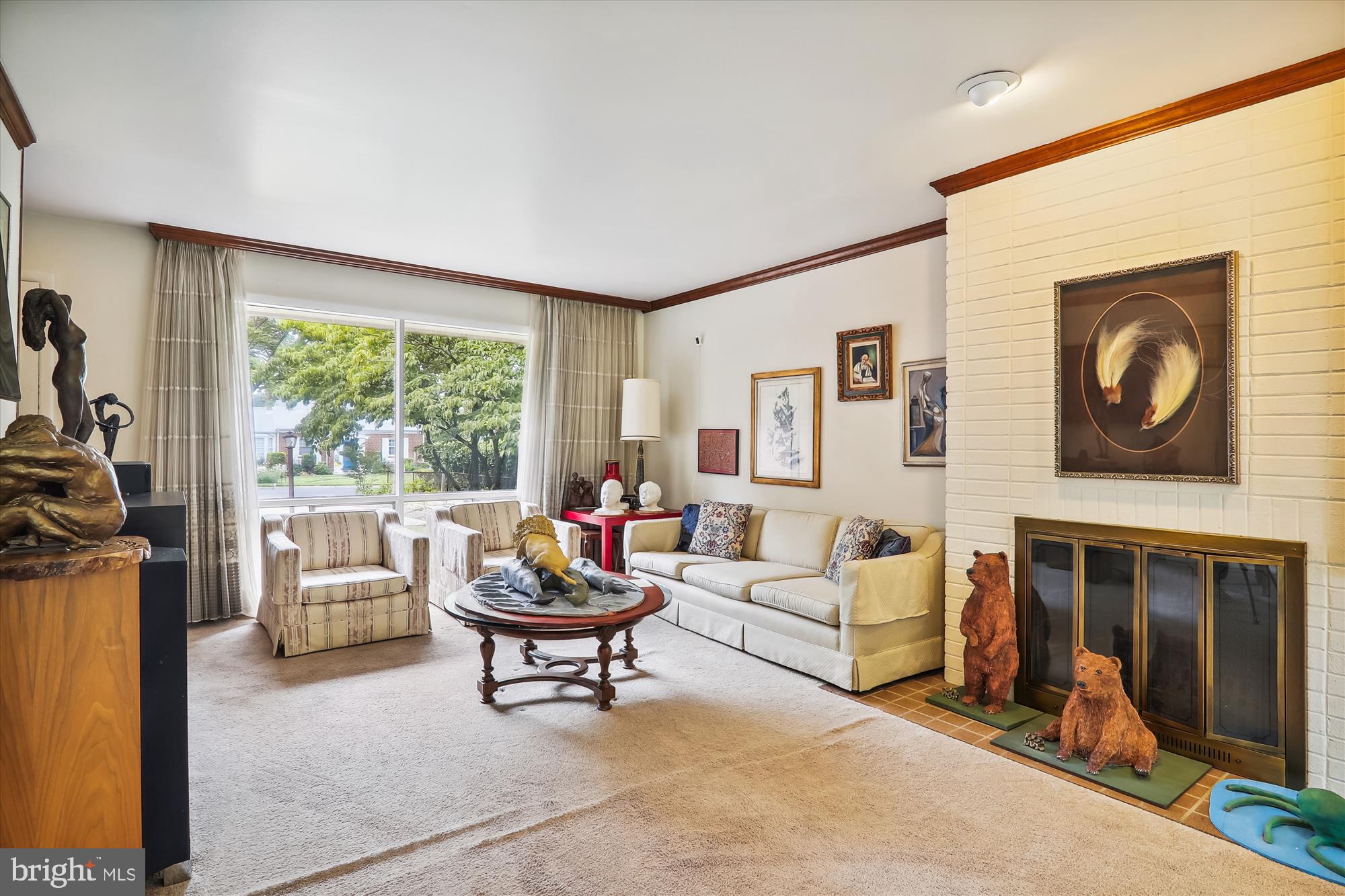 122 St Lawrence Drive Silver Spring, MD 20901 - Photo 5 of 9 a living room with furniture a fireplace and a large window