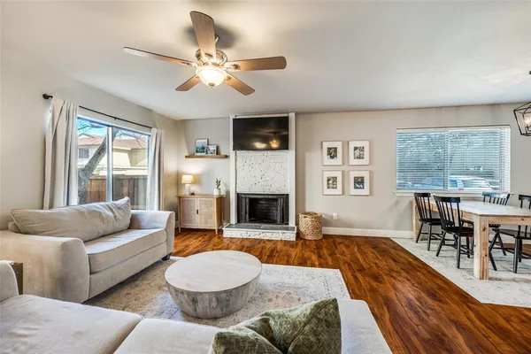 a living room with furniture and a fireplace