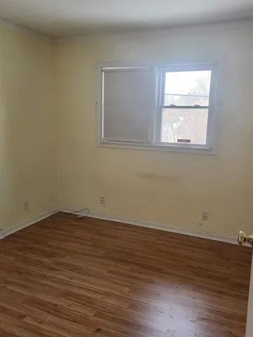 a bathroom with a sink toilet and window