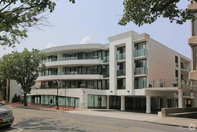 a front view of a building with a street