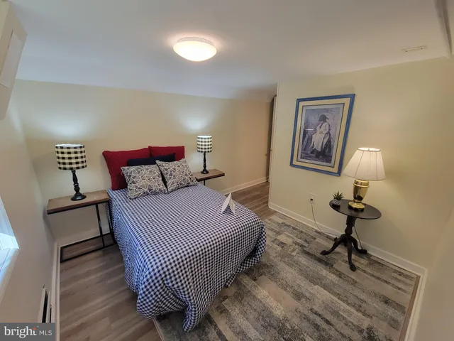 a bedroom with bed and a window