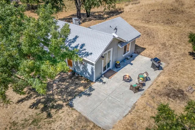 an aerial view of a house with swimming pool