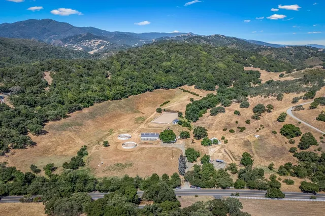 an aerial view of a house with a yard