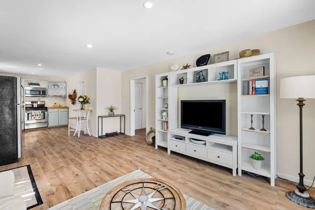 a view of living room with furniture and flat screen tv