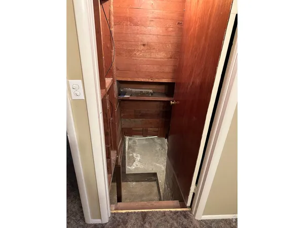 a room with a bed and a mirror