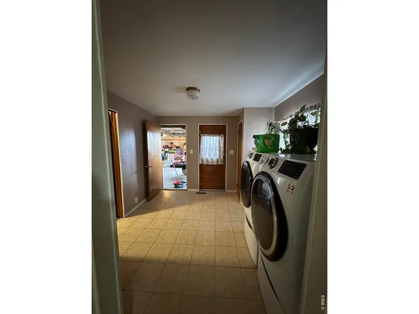 a view of a backyard with sitting area