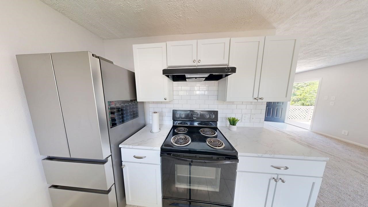 619 Cotter Drive Spring, TX 77373 - Photo 46 of 50 a kitchen with stainless steel appliances a stove and a refrigerator