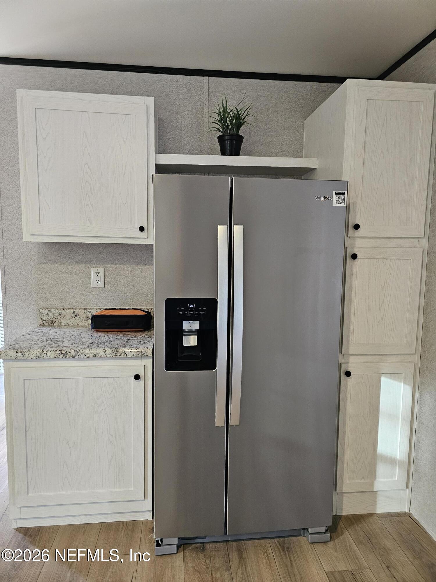 295 Baden Powell Road Hawthorne, FL 32640 - Photo 12 of 15 a kitchen with a refrigerator and a stove