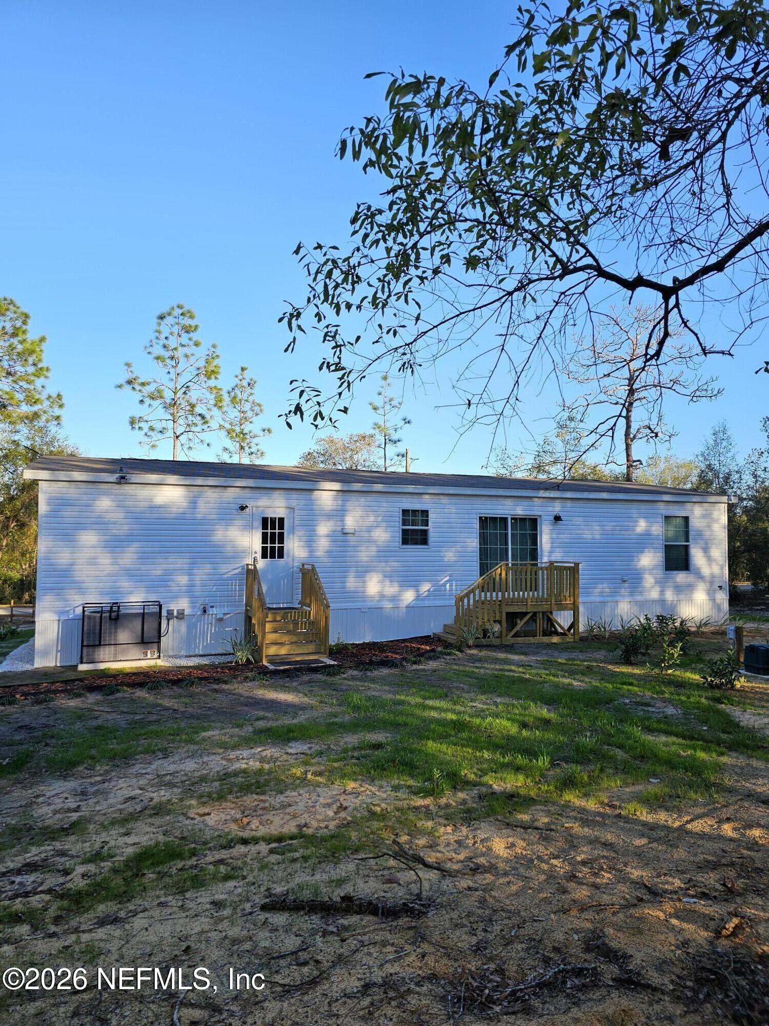 295 Baden Powell Road Hawthorne, FL 32640 - Photo 2 of 15 a view of a house with backyard