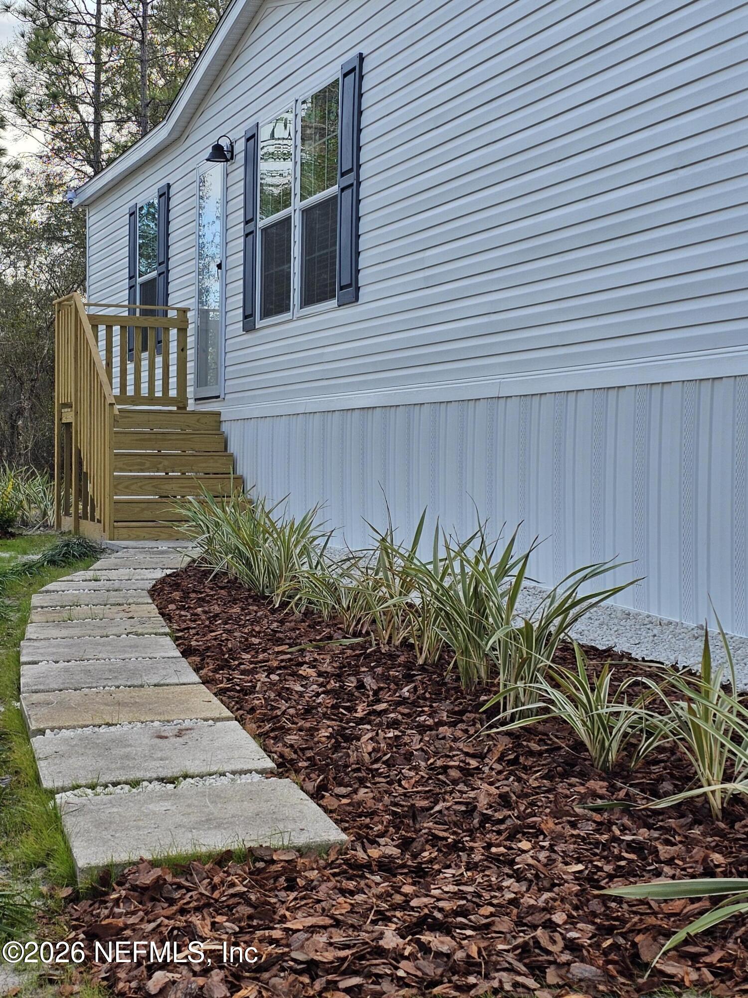 295 Baden Powell Road Hawthorne, FL 32640 - Photo 3 of 15 a view of a pathway with a yard