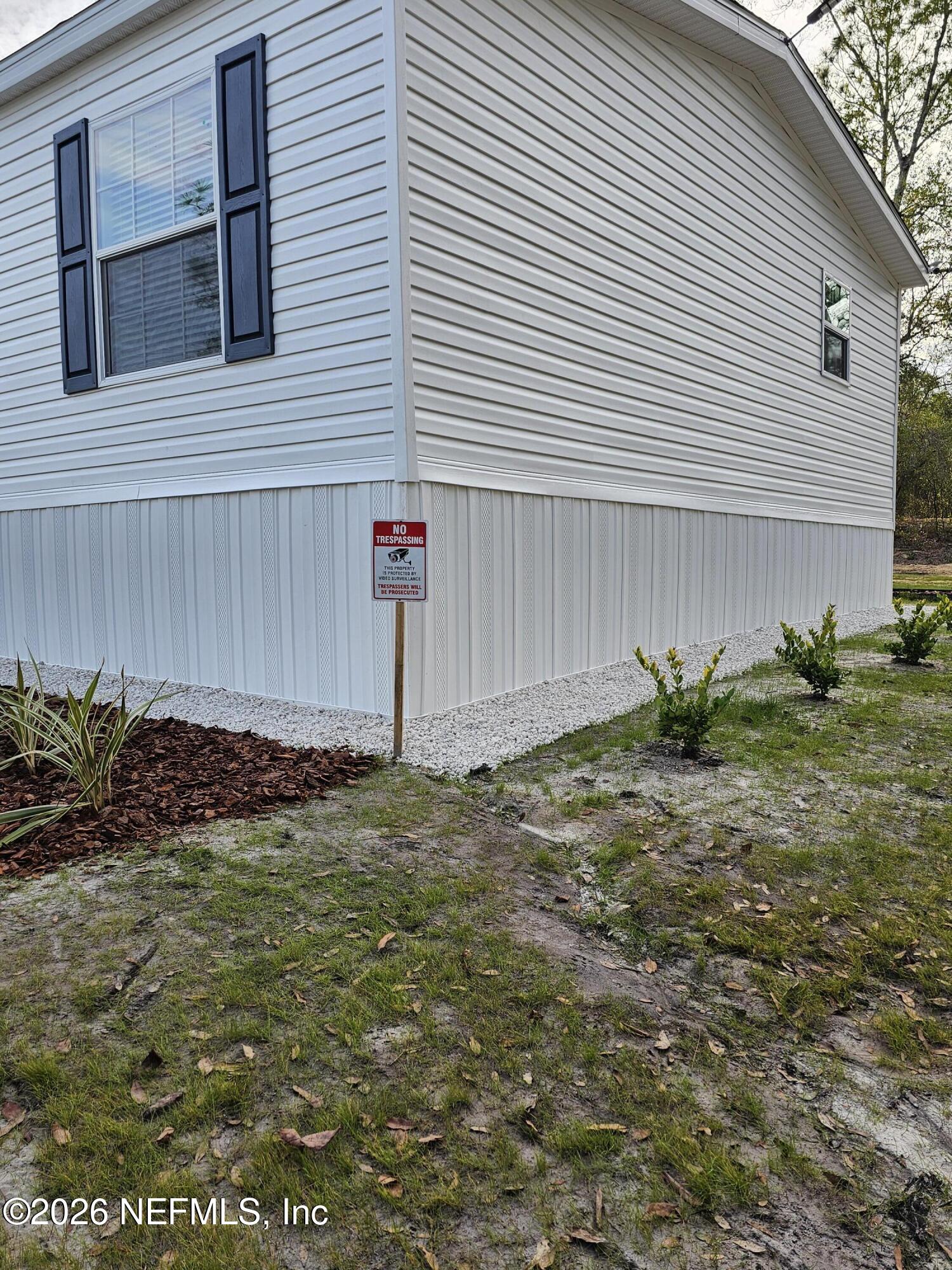 295 Baden Powell Road Hawthorne, FL 32640 - Photo 5 of 15 a backyard of a house