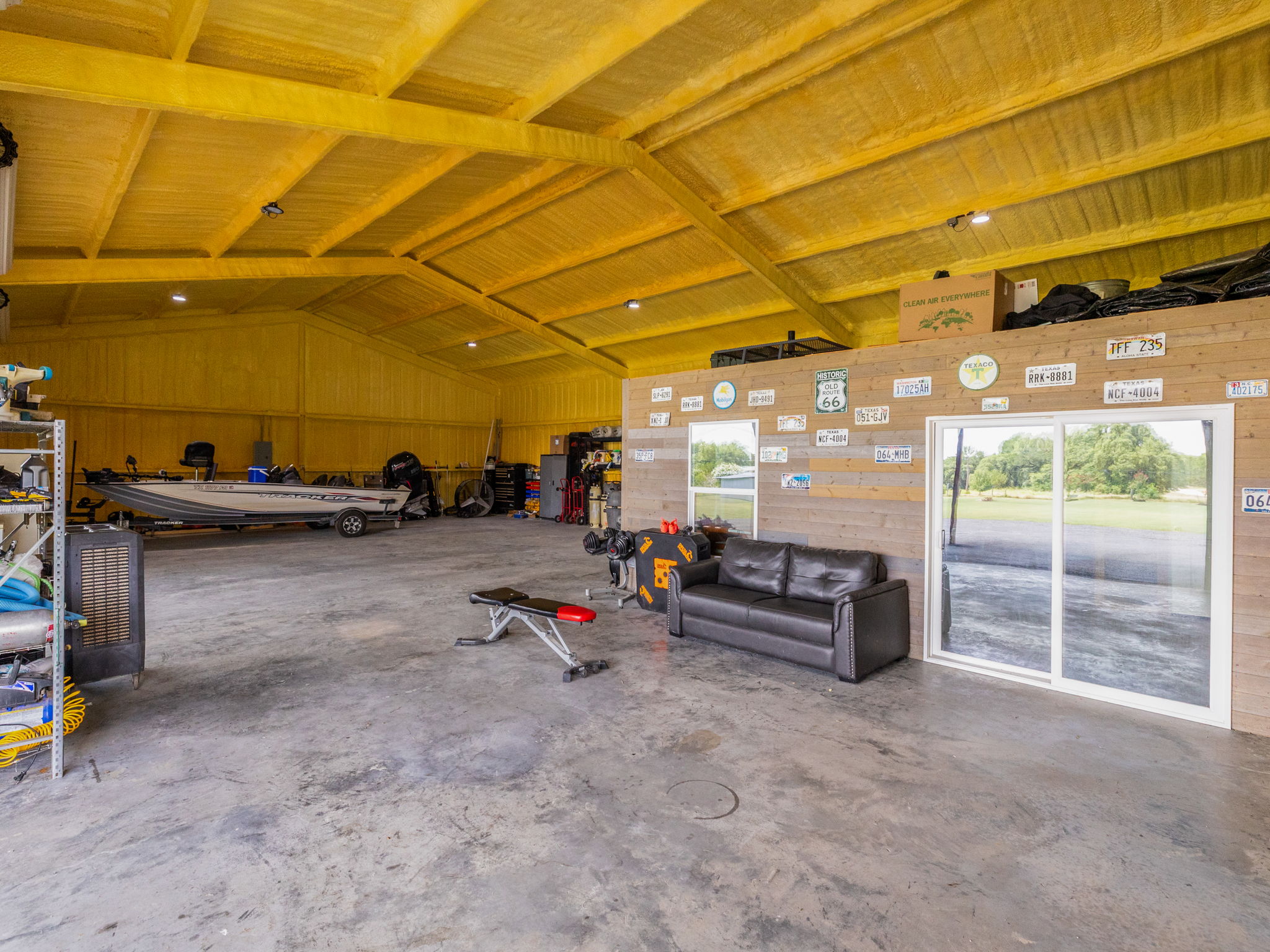 3001 County Road 255 Georgetown, TX 78633 - Photo 30 of 35 The foam insulated spacious workshop provides ample room for projects and storage, illuminated by natural light.