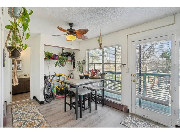 a view of a dining room with furniture and a window